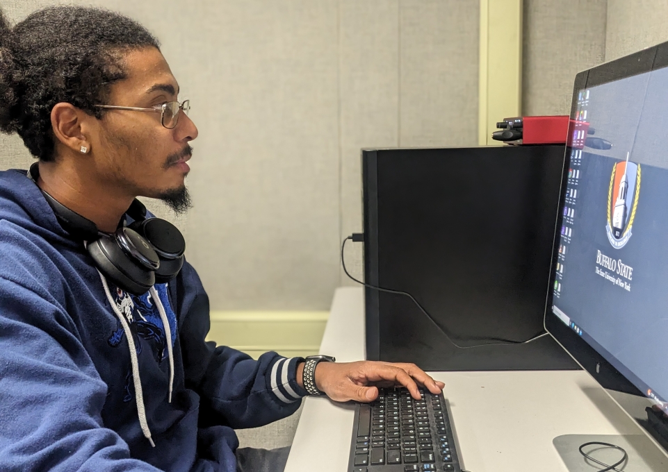 Buffalo State student using a computer